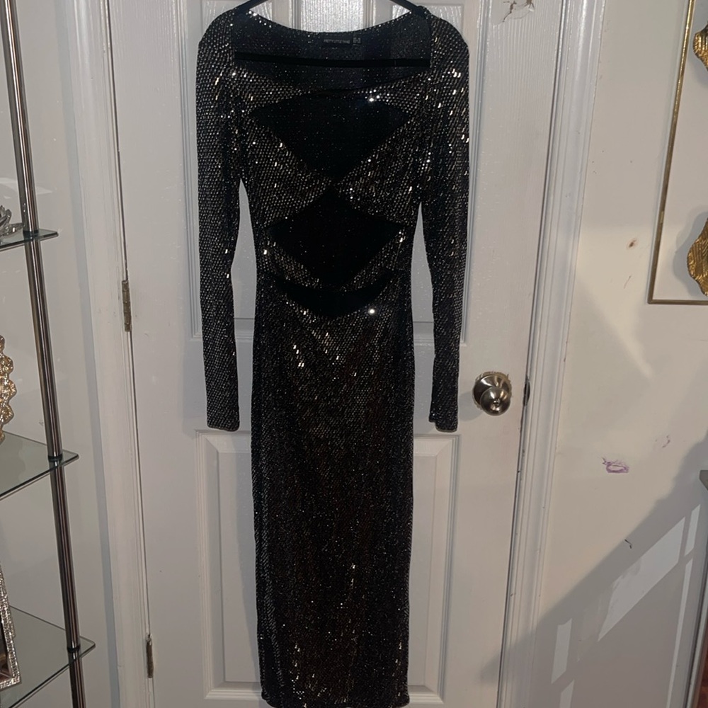 This black/silver open in front sequin dress is perfect for club or date night